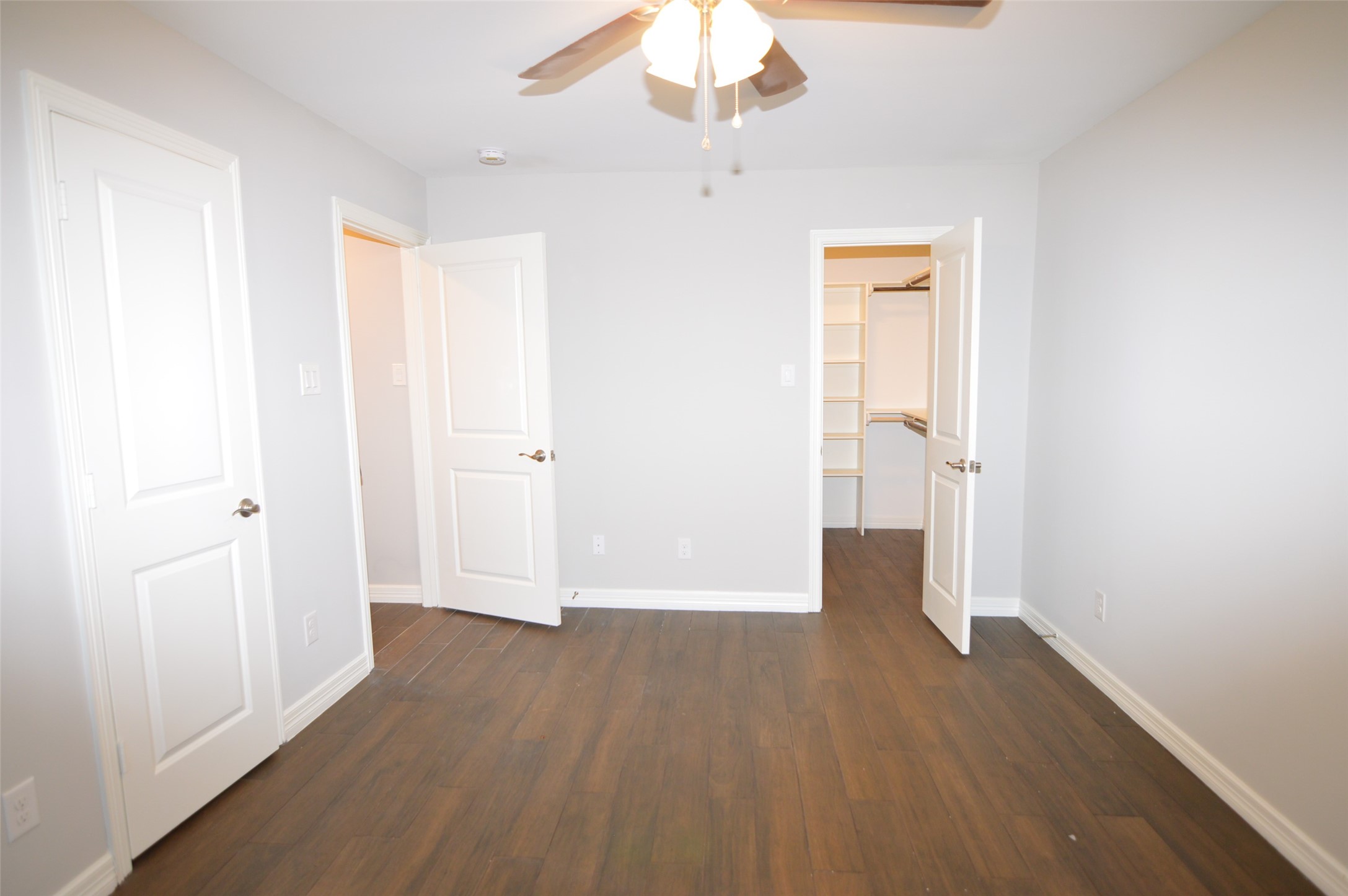 10002 Neuens Road, Unit 2 Houston, TX 77080 - Photo 9 of 15 wooden floor in an empty room with a window
