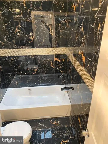 a bathroom with a sink and toilet