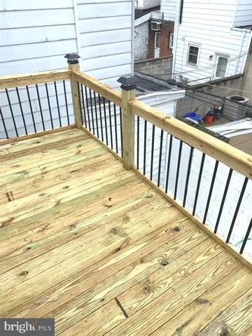 a view of balcony with wooden floor