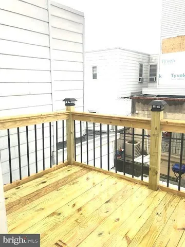 a large white building with swimming pool in front of it