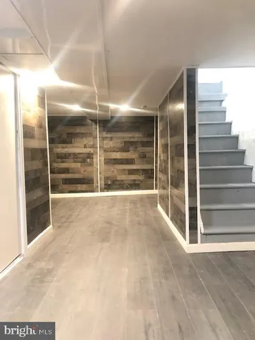 a view of an empty room with a fireplace