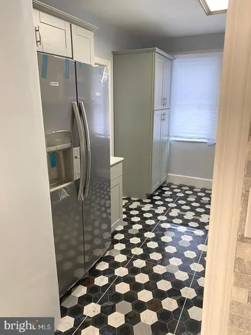 a bathroom with a glass door shower