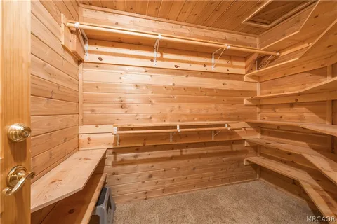 a view of balcony with wooden floor and door