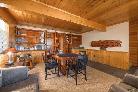 a kitchen with a refrigerator and cabinets