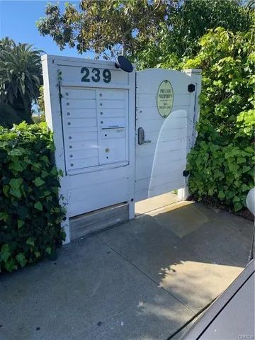 a view of a wooden door and a yard