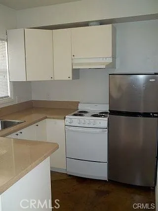 a bathroom with a shower a toilet and a sink