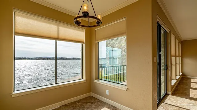 a kitchen with stainless steel appliances granite countertop a sink refrigerator and cabinets