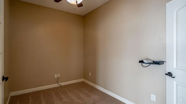 a view of a bedroom with washer and dryer