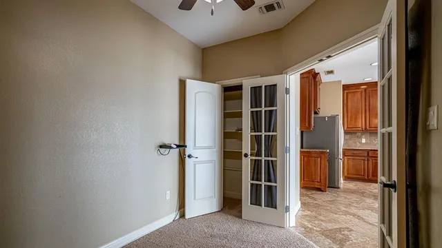 a view of a hallway with washer and dryer