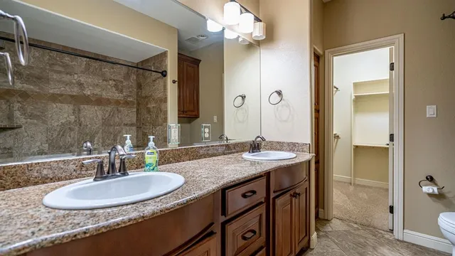 an empty room with closet and entryway