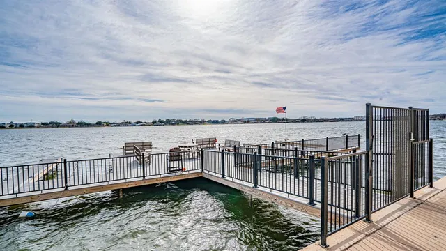 a swimming pool with chairs