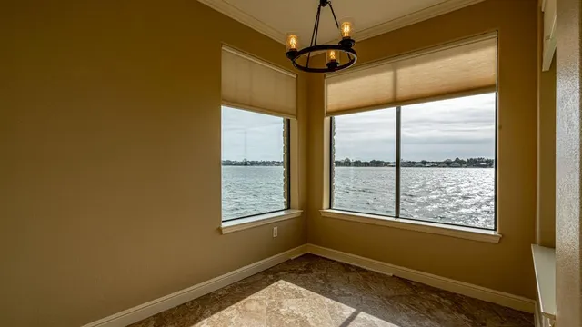 a kitchen with stainless steel appliances granite countertop a refrigerator a stove a sink and a microwave