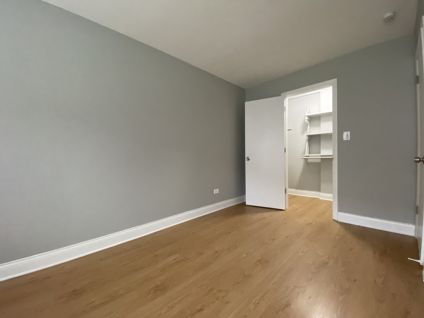 9368 Golf Road, Unit 1A Des Plaines, IL 60016 - Photo 11 of 21 a view of an empty room with closet and a window