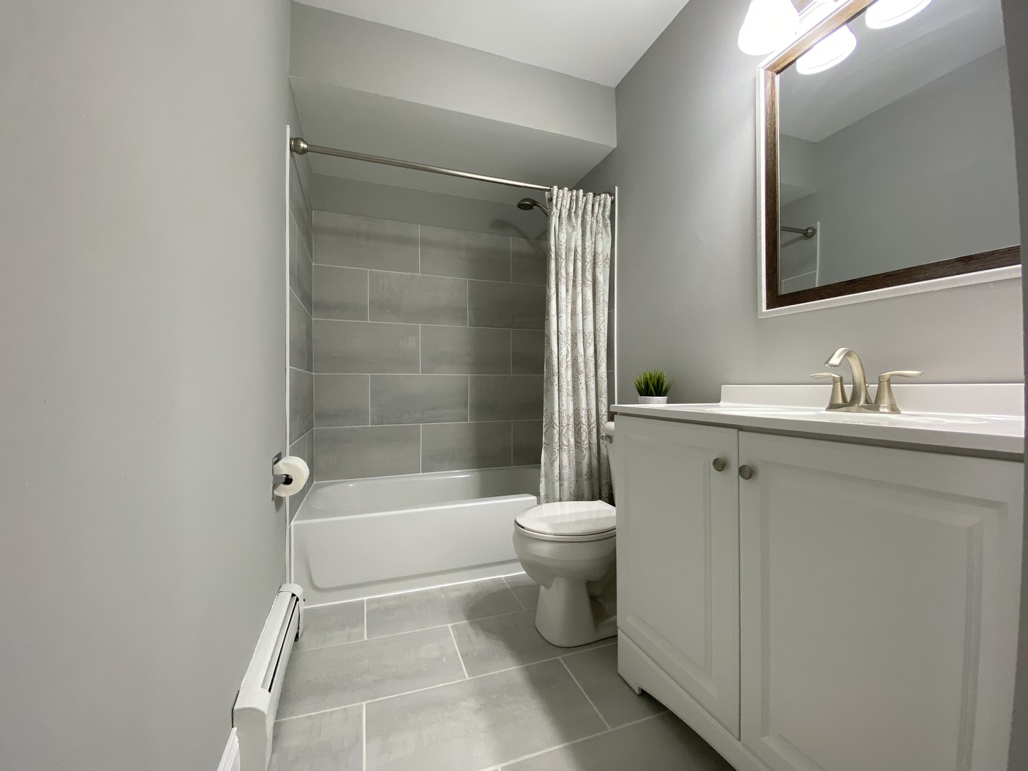 9368 Golf Road, Unit 1A Des Plaines, IL 60016 - Photo 13 of 21 a bathroom with a sink toilet and shower