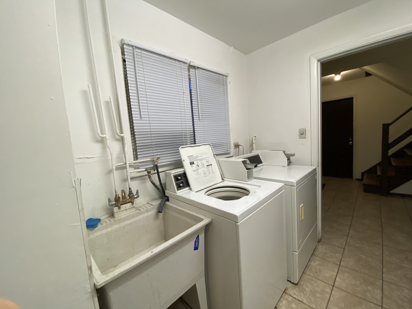 9368 Golf Road, Unit 1A Des Plaines, IL 60016 - Photo 15 of 21 a utility room with dryer and washer