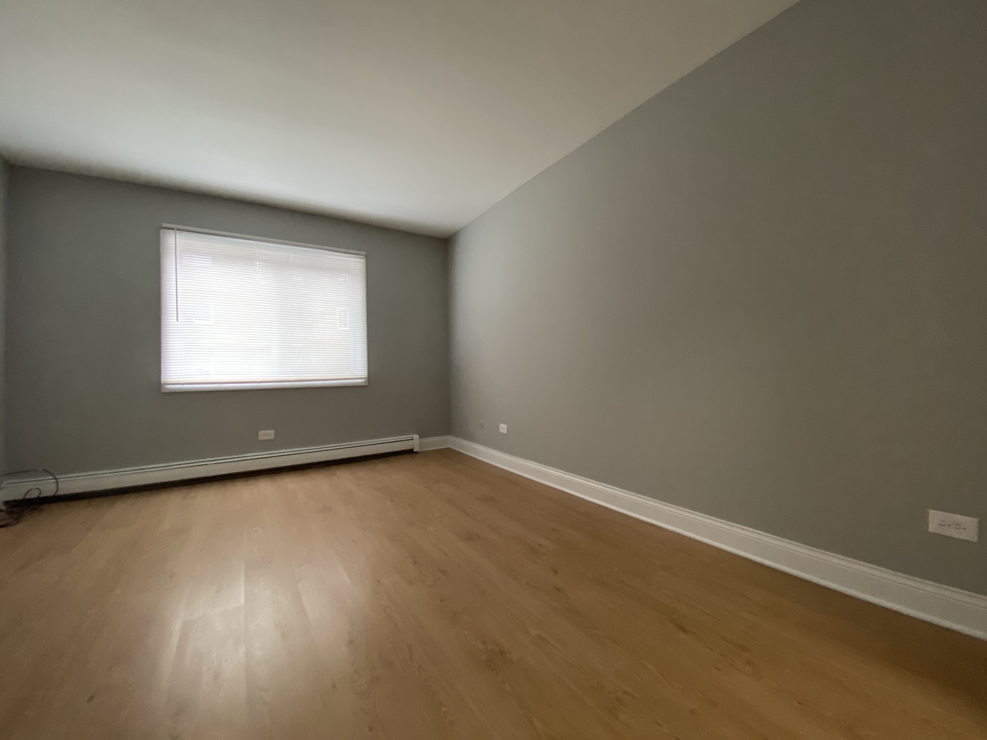 9368 Golf Road, Unit 1A Des Plaines, IL 60016 - Photo 9 of 21 an empty room with a window