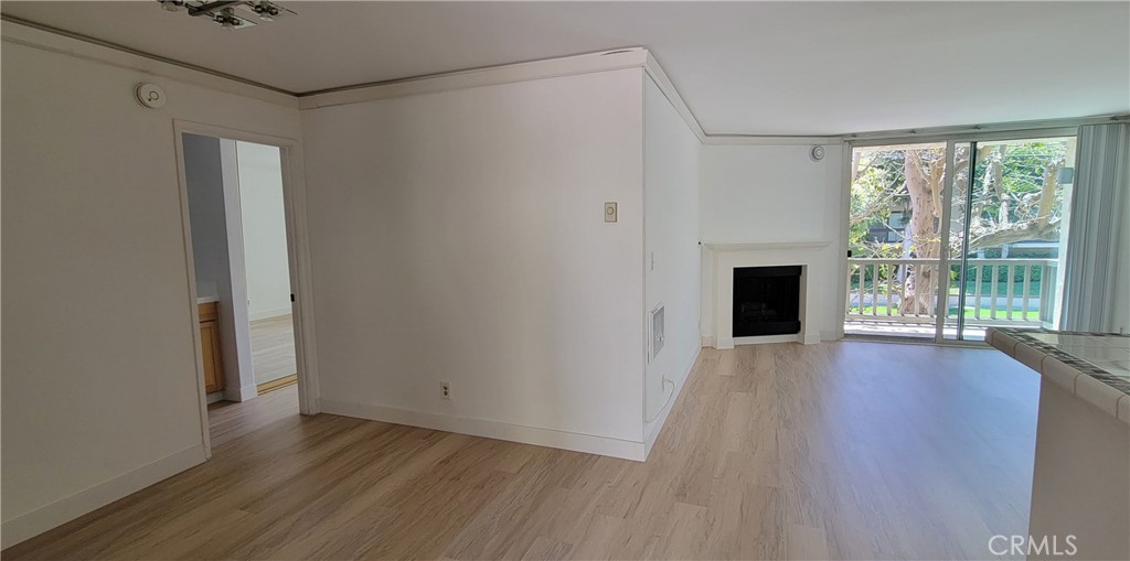 8740 Tuscany Avenue Playa del Rey, CA 90293 - Photo 5 of 21 a view of empty room with wooden floor and fan