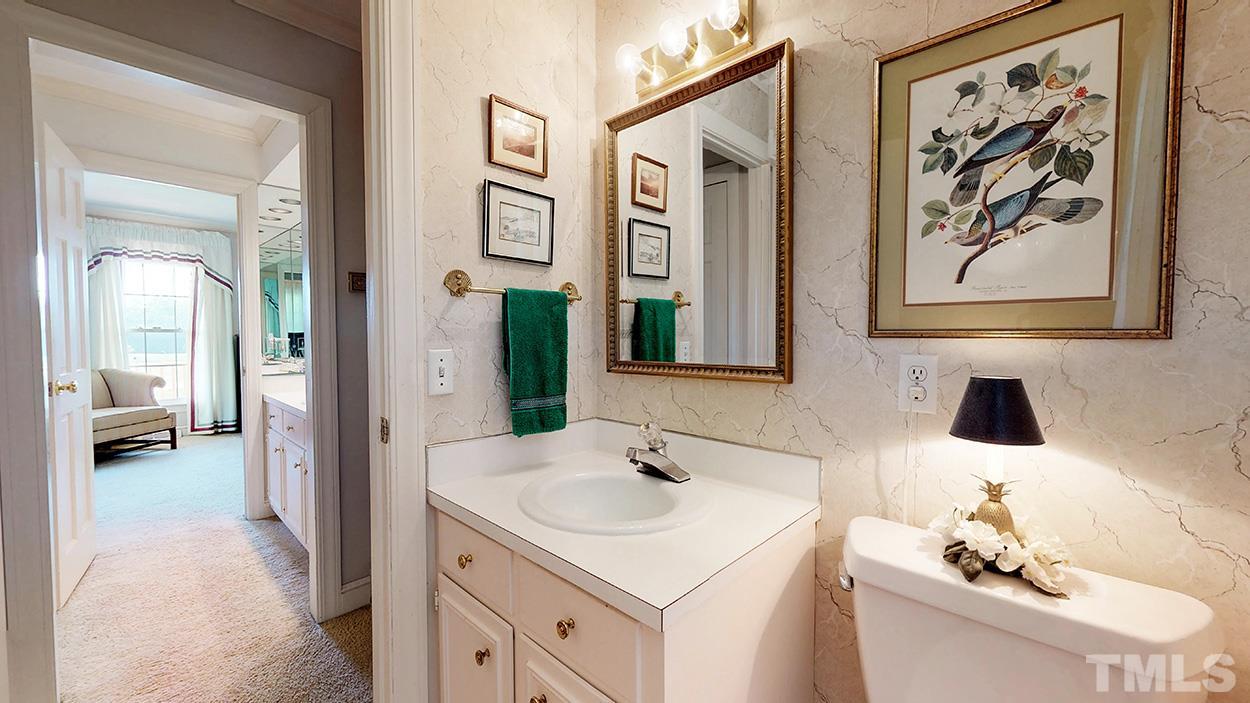 3322 Dick Holeman Road Timberlake, NC 27583 - Photo 13 of 30 a en suite bathroom with a sink and a mirror