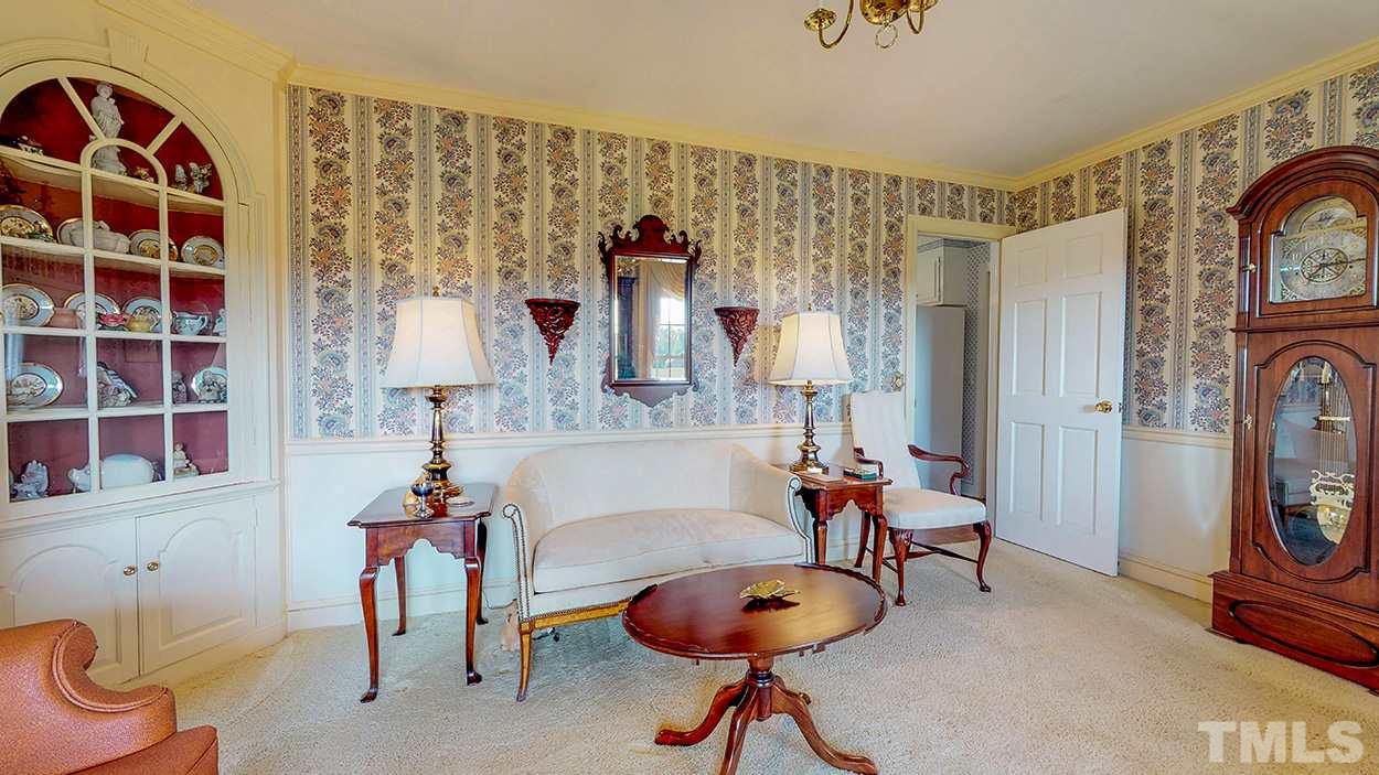 3322 Dick Holeman Road Timberlake, NC 27583 - Photo 22 of 30 a living room with furniture and a chandelier