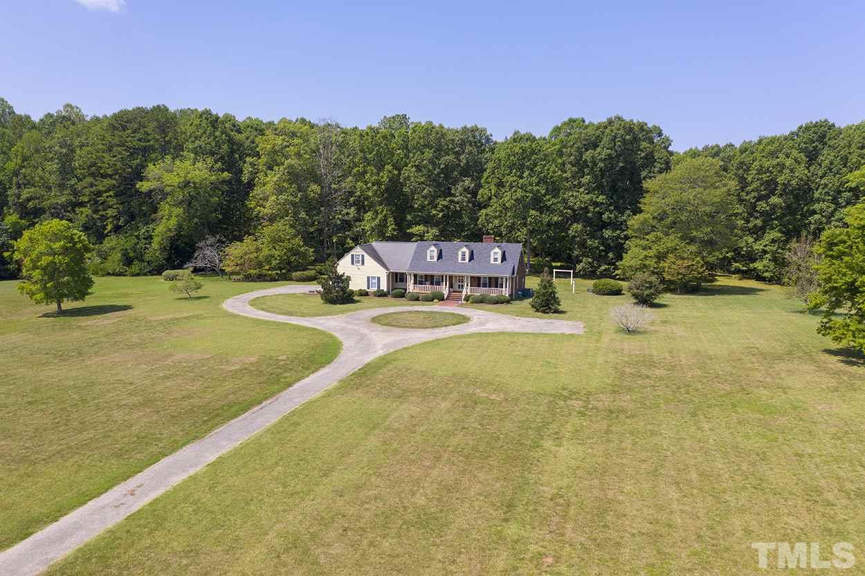 3322 Dick Holeman Road Timberlake, NC 27583 - Photo 28 of 30 a view of a swimming pool with an outdoor space and seating area