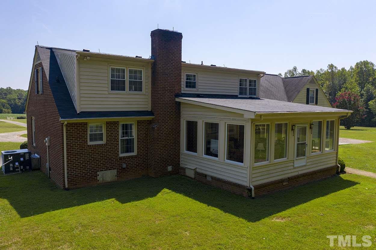3322 Dick Holeman Road Timberlake, NC 27583 - Photo 29 of 30 a view of a house with a yard and sitting area