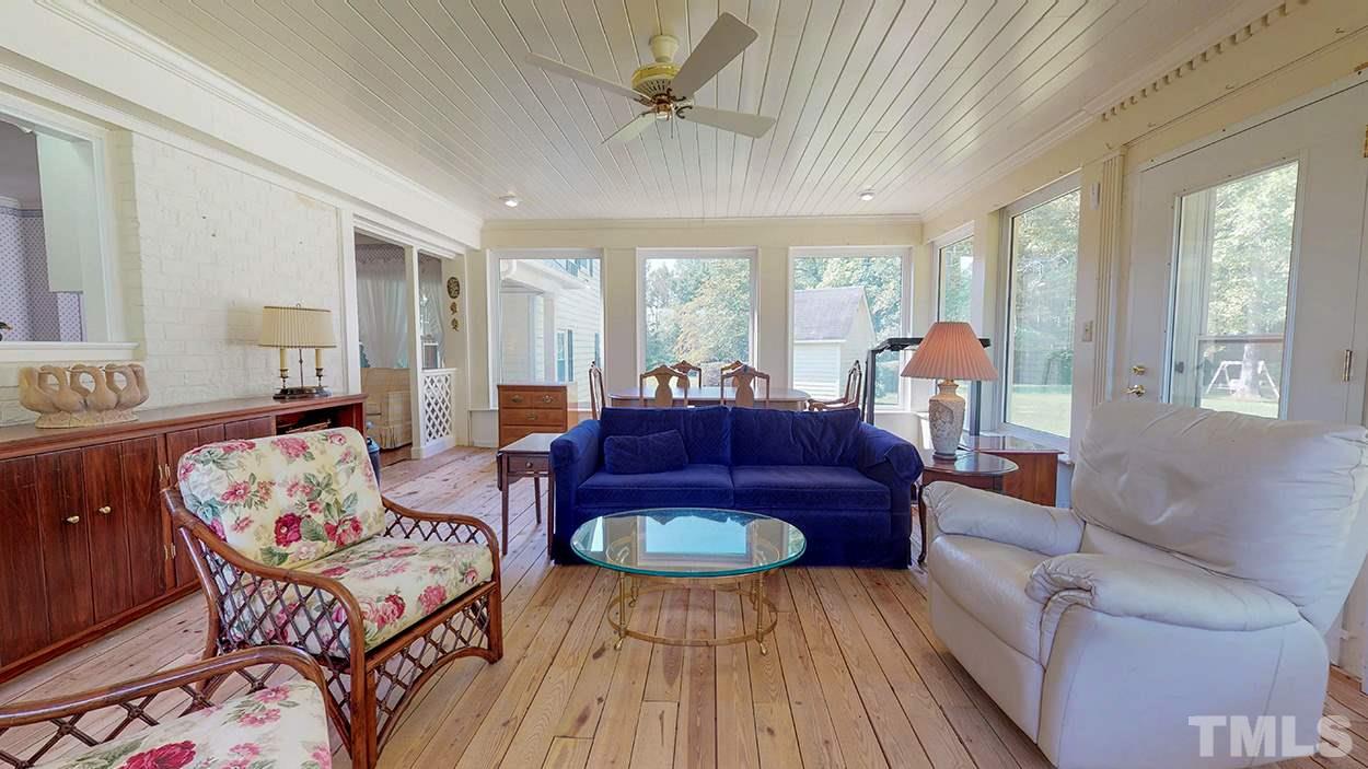 3322 Dick Holeman Road Timberlake, NC 27583 - Photo 6 of 30 a living room with furniture and a large window