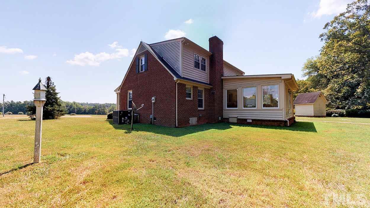 3322 Dick Holeman Road Timberlake, NC 27583 - Photo 8 of 30 a house view with a swimming pool in front of it