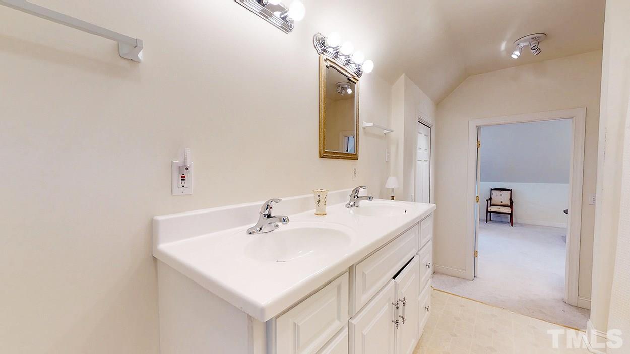 3322 Dick Holeman Road Timberlake, NC 27583 - Photo 9 of 30 a bathroom with a sink and a mirror