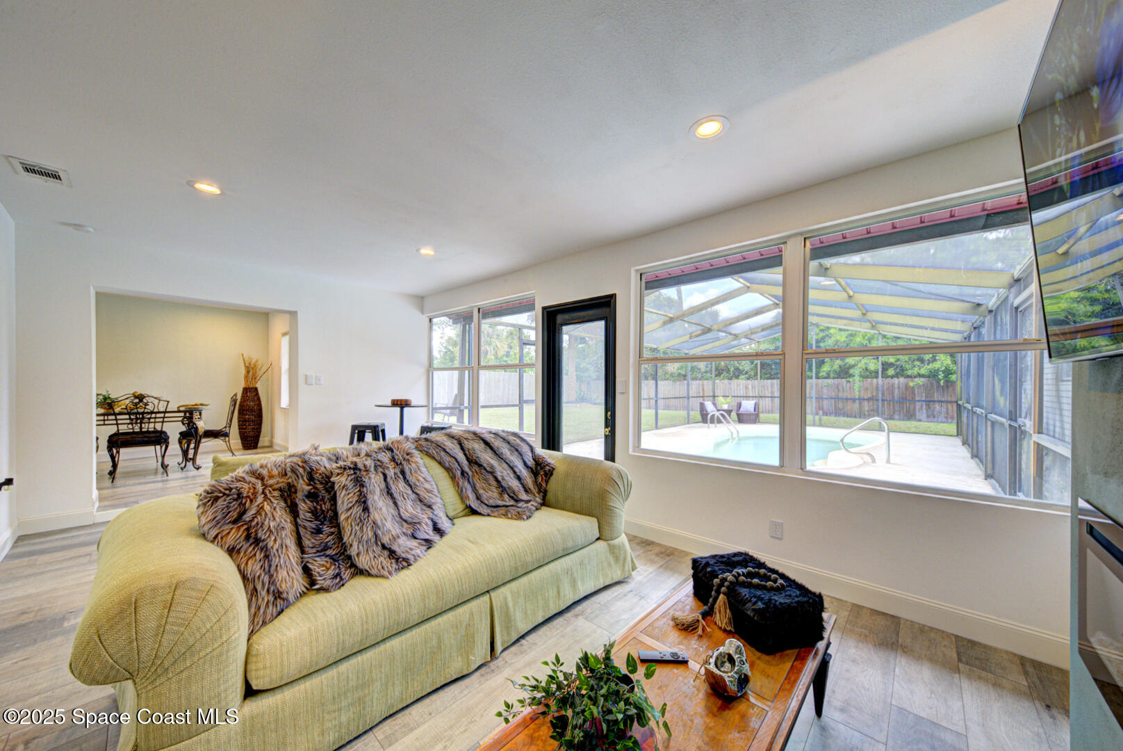 5049 Jamaica Road Cocoa, FL 32927 - Photo 17 of 24 a living room with furniture and a large window