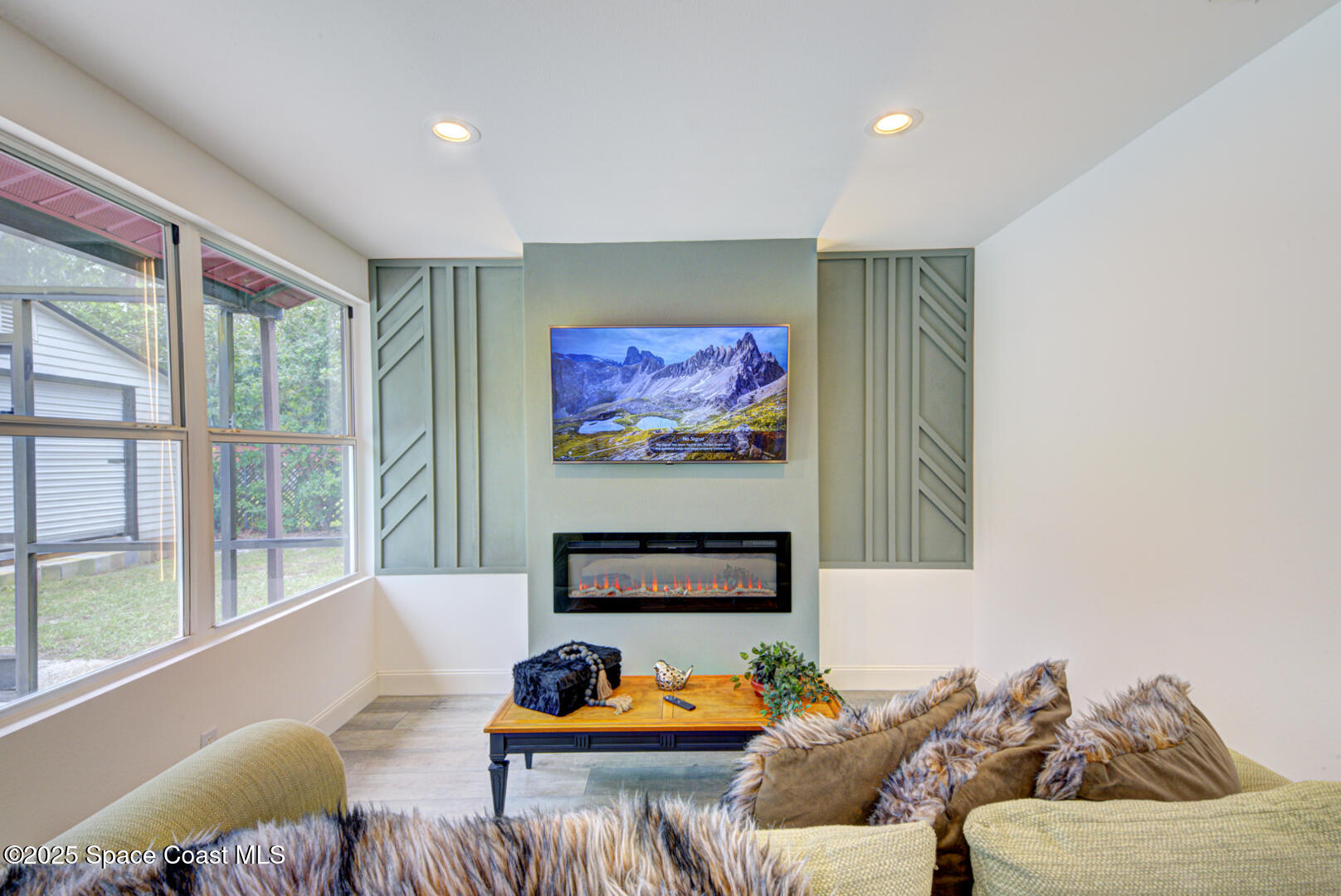 5049 Jamaica Road Cocoa, FL 32927 - Photo 18 of 24 a living room with furniture kitchen view and a large window