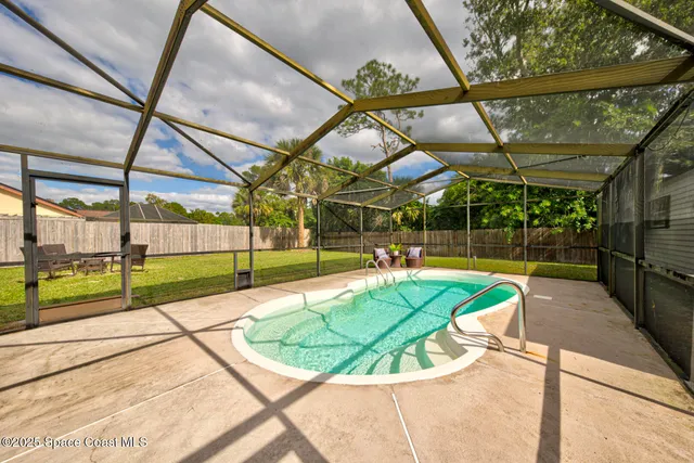 a view of a swimming pool with a patio