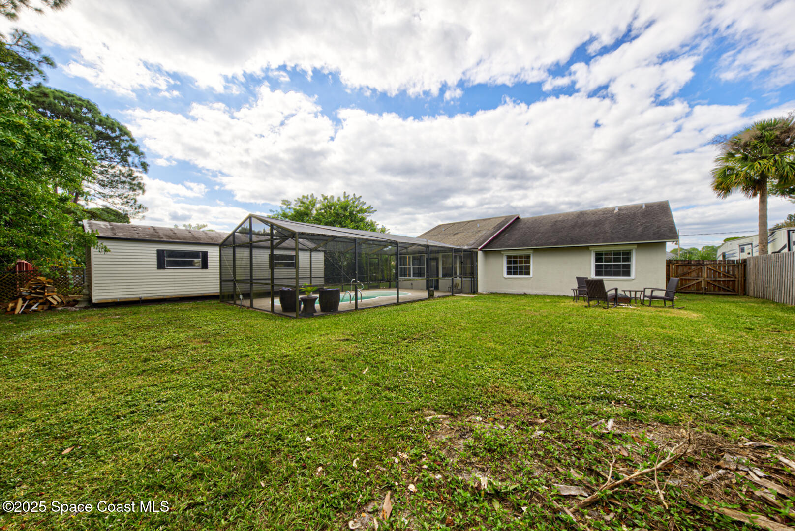 5049 Jamaica Road Cocoa, FL 32927 - Photo 22 of 24 a front view of house with yard and green space