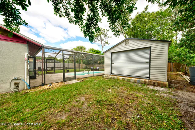 a view of backyard and garden