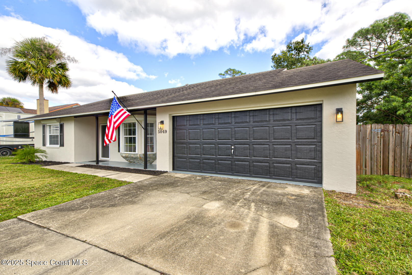 5049 Jamaica Road Cocoa, FL 32927 - Photo 3 of 24 a front view of house with yard