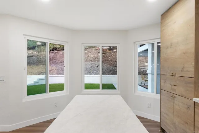 a view of a room with a large window