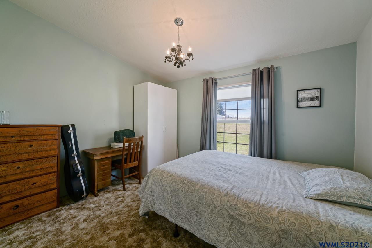 153 Hylo Road Southeast Salem, OR 97306 - Photo 26 of 41 a bedroom with a bed dresser and a window