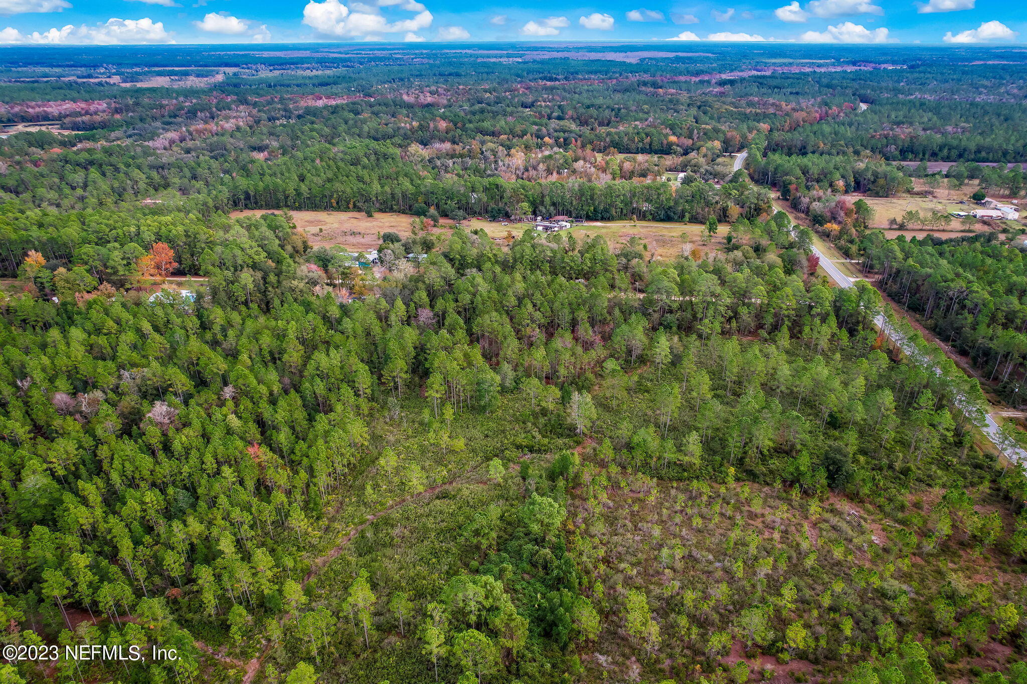 0 Unassigned Address Interlachen, FL 32148 - Photo 15 of 35 a view of a city with lush green forest