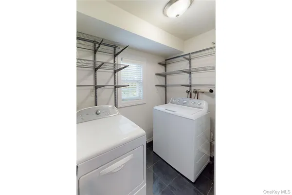a utility room with a sink dryer and washer