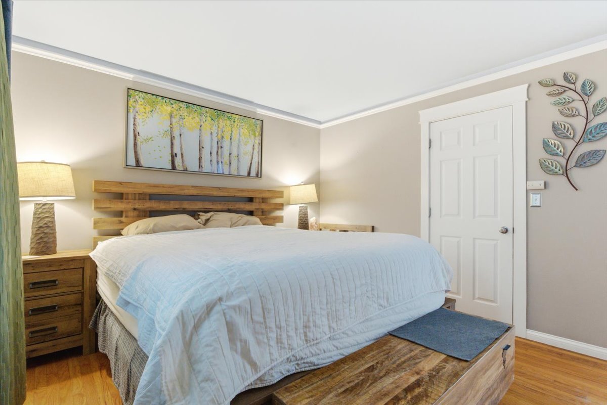 2105 Sprucewood Lane Lindenhurst, IL 60046 - Photo 13 of 37 a bedroom with a bed and wooden floor