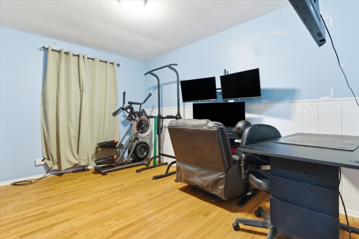 2105 Sprucewood Lane Lindenhurst, IL 60046 - Photo 16 of 37 a view of a workspace with furniture and a window