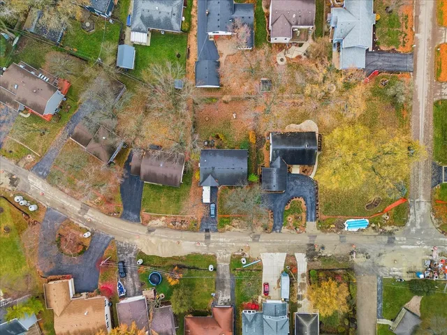 an aerial view of a houses with outdoor space