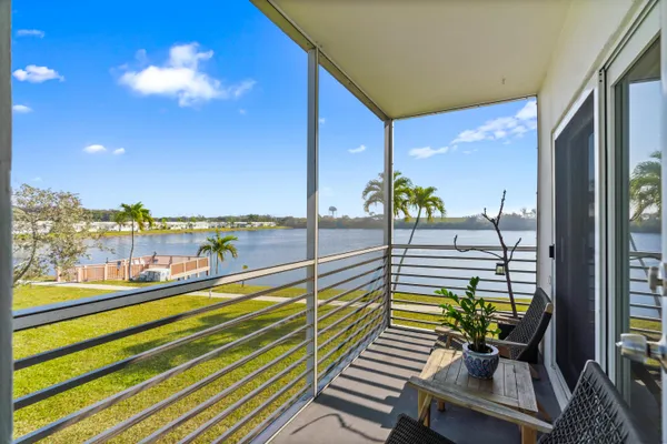 a view of a balcony with chairs