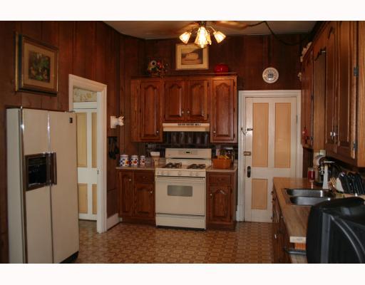 5337 Hardt Road Gibsonia, PA 15044 - Photo 8 of 14 Kitchen. Spacious kitchen with plentiful oak cabinetry, 2 ceiling fans and a walk-out entry to the side porch.