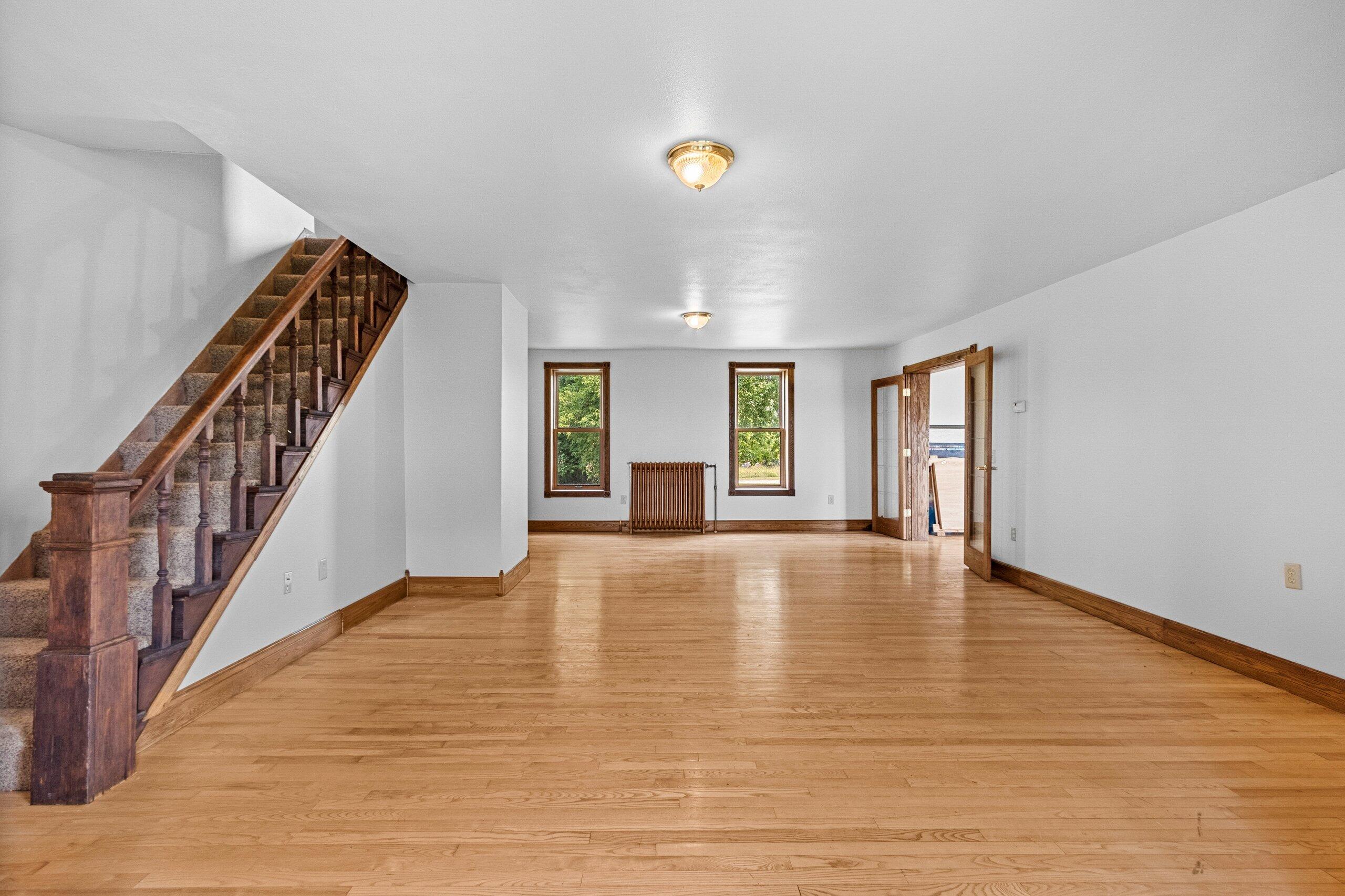 W3966 32nd Road Carney, MI 49812 - Photo 11 of 77 Family Room with stairs to 2nd floor