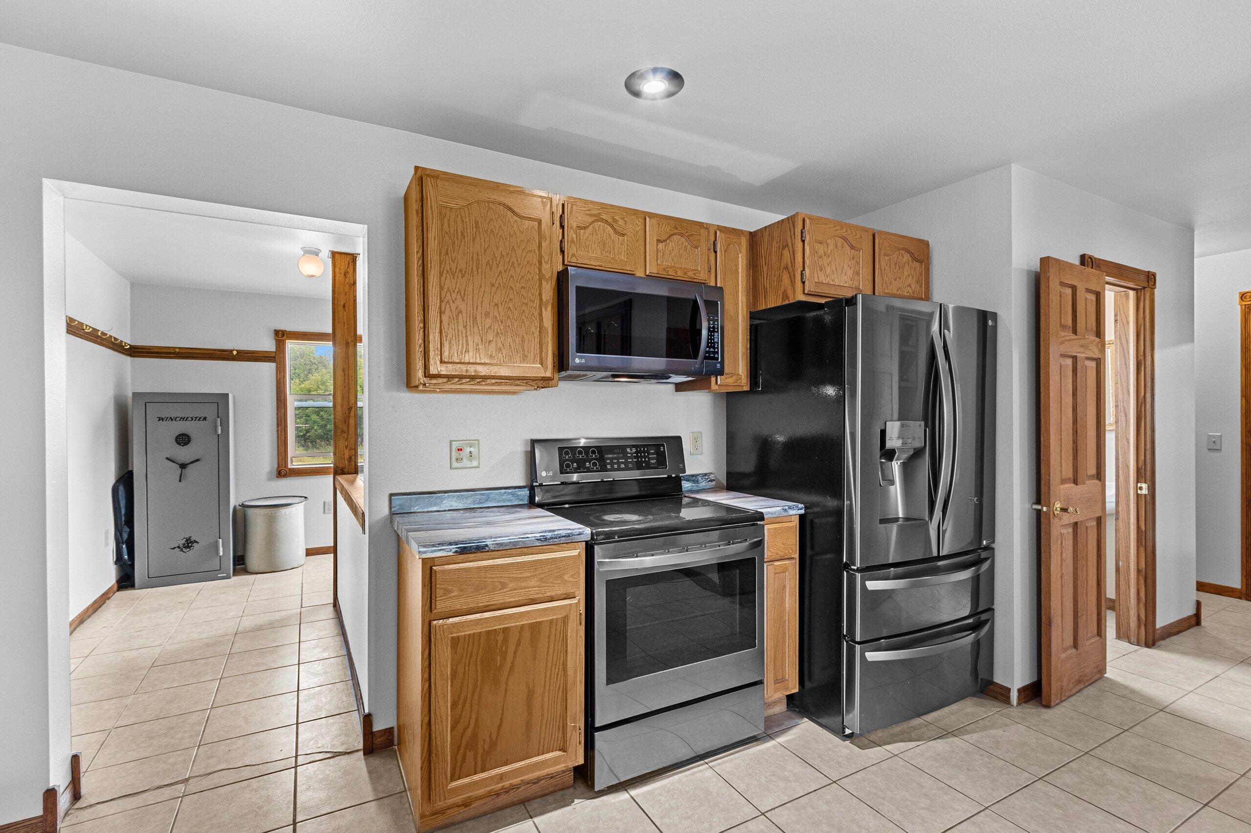 W3966 32nd Road Carney, MI 49812 - Photo 13 of 77 Kitchen and rear entry