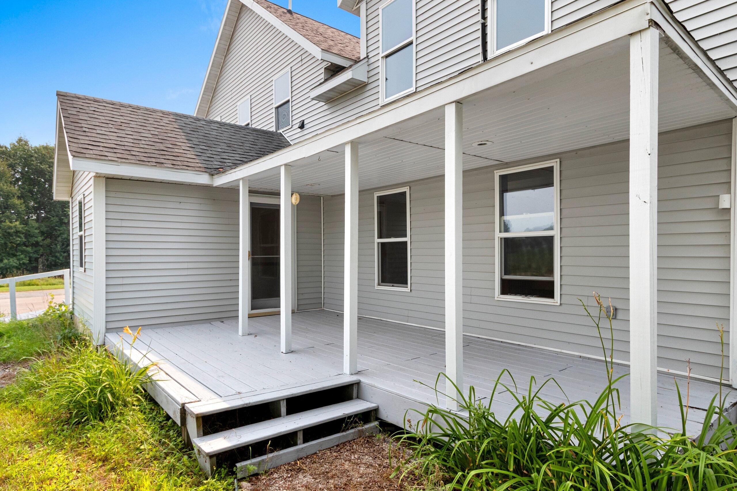 W3966 32nd Road Carney, MI 49812 - Photo 70 of 77 2nd Back Large Porch (4) behind LR and off back entry