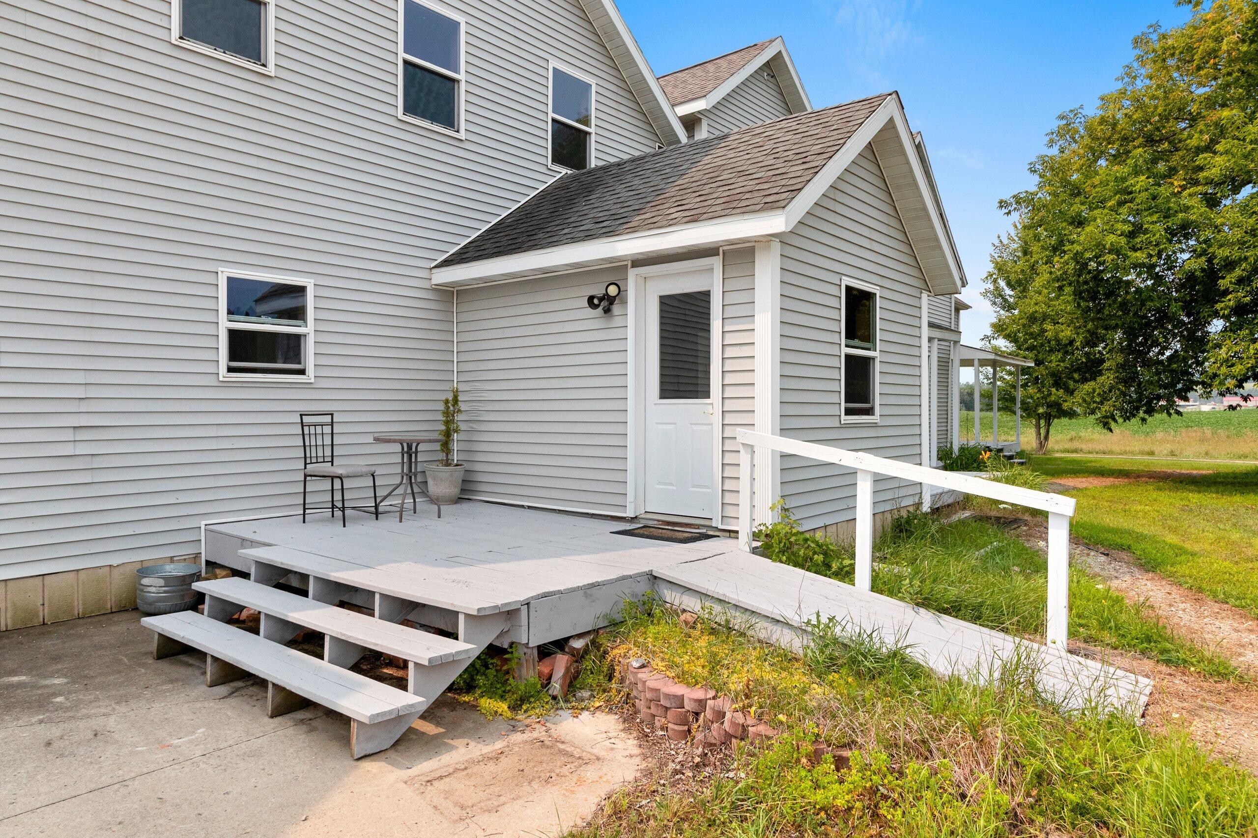 W3966 32nd Road Carney, MI 49812 - Photo 71 of 77 3rd Back lower Porch(5) off entry way with handicap access & concrete patio