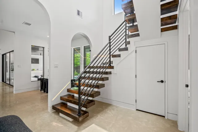 a view of entryway with livingroom and stairs