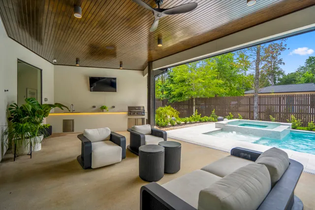 a view of a patio with couches and potted plants