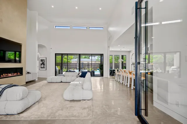 a large living room with furniture and a flat screen tv